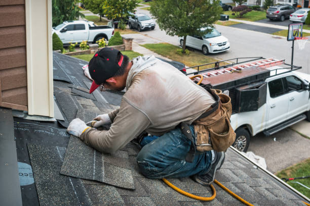 Professional Roofing technician working in West End, NC